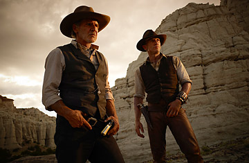 Harrison Ford as the iron-fisted Colonel Dolarhyde and Daniel Craig as a stranger with no memory of his past in Cowboys & Aliens.