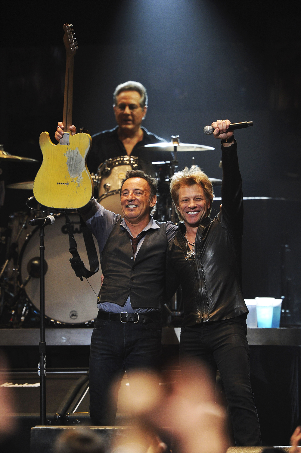 Bruce Springsteen and Jon Bon Jovi perform during "12-12-12" a concert