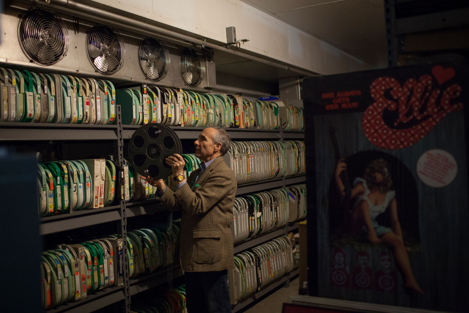 Kaufman files a reel from the 35mm print of the 1987 film 'Troma's Wa' in the archives at Troma's offices.