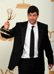 Actor Kyle Chandler holds the award for