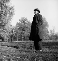 Scholar C.S. Lewis standing in open field; nr. Magdalen College, Oxford University, 1946