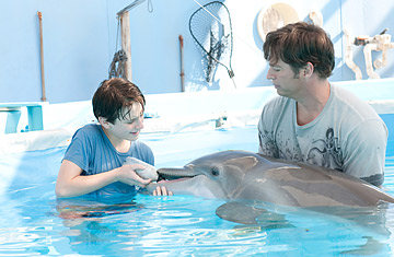 Nathan Gamble and Harry Connick Jr. in Dolphin Tale