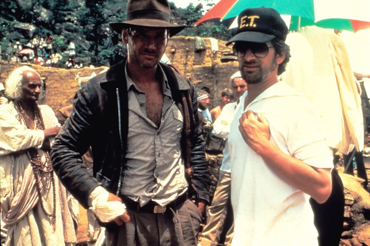 Spielberg and Harrison Ford during the filming of Temple of Doom
