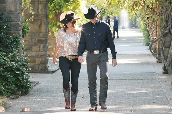 brown cowboy boots with black hat