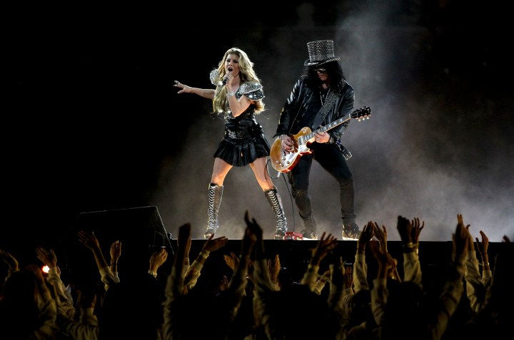 Fergie of the Black Eyed Peas performs with Slash during the Bridgestone Super Bowl XLV Halftime Show at Cowboys Stadium on Feb. 6, 2011 in Arlington, Texas. 