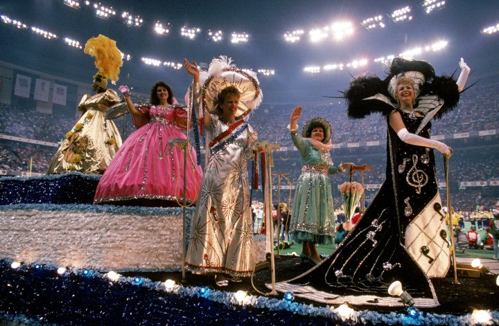 Mardi Gras themed floats with women waving roll by during the pregame show before the San Francisco 49ers take on the Denver Broncos prior to Super Bowl XXIV at Louisiana Superdome in New Orleans, La., on Jan. 28, 1990.