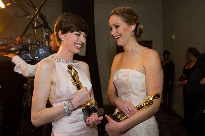 Jennifer Lawrence, winner of the Oscar for Performance by an actress in a Leading Role for 'Silver Linings Playbook' and Anne Hathaway after winning the category performance by an actress in a supporting role for her part in 'Les Miserables' laughing as they hold their Oscars backstage at the 85th Academy Awards at the Dolby Theatre in Hollywood, Calif., on Feb. 24, 2013.  
