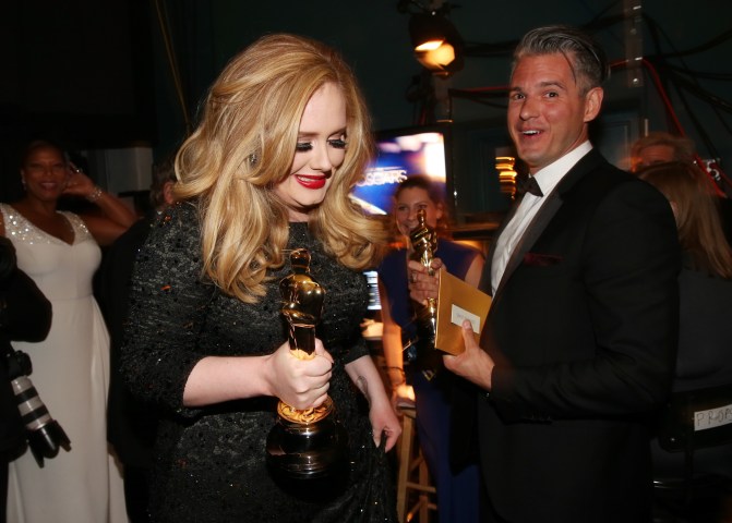 Singer-songwriter Adele and Paul Epworth, winners of the Best Original Song Oscar for the title song of 'Skyfall,' appear backstage during the Oscars held at the Dolby Theatre on Feb. 24, 2013 in Hollywood, Calif.