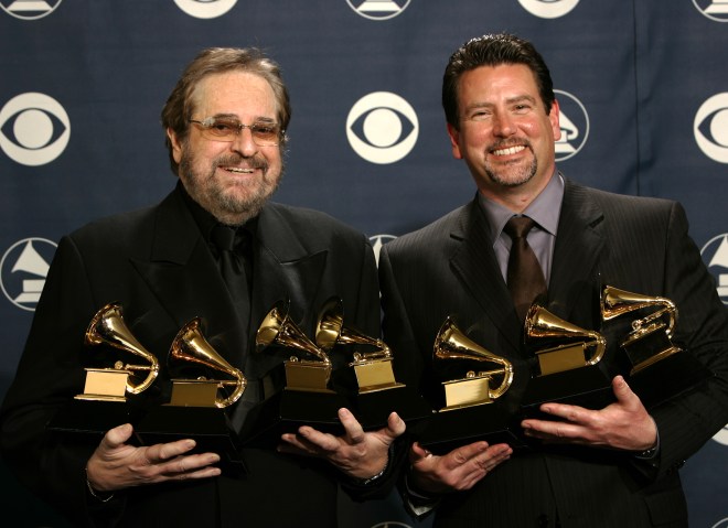 Producers Phil Ramone and John Burk hold the awards won by Ray Charles and his album "Genius Loves ...