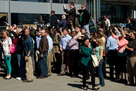 Onlookers and media outside the US.Federal Courthouse as it is evacuated because of a bomb threat April 17, 2013 in Boston.