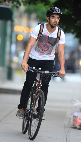 Joe Jonas rides his bike in Soho in New York City, on May 22, 2013.