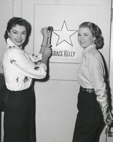 Ester Williams and Grace Kelly Next to a Dressing Room Door