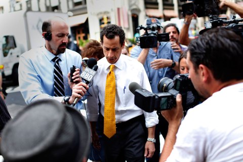 Democratic candidate for New York City Mayor Anthony Weiner is followed by media as he leaves his New York City apartment, July 24, 2013.