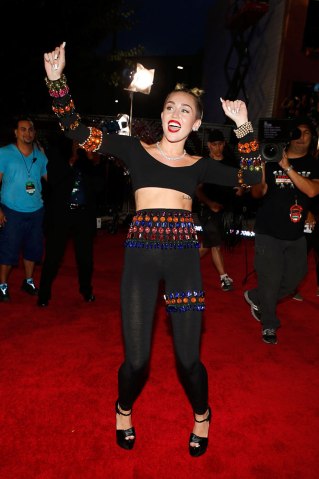 Miley Cyrus arrives at the 2013 MTV VMA Awards red carpet at the Barclay's Center in Brooklyn, N.Y., on Aug. 25, 2013.