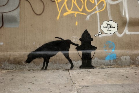 General views of two works attributed to the artist Banksy in New York City