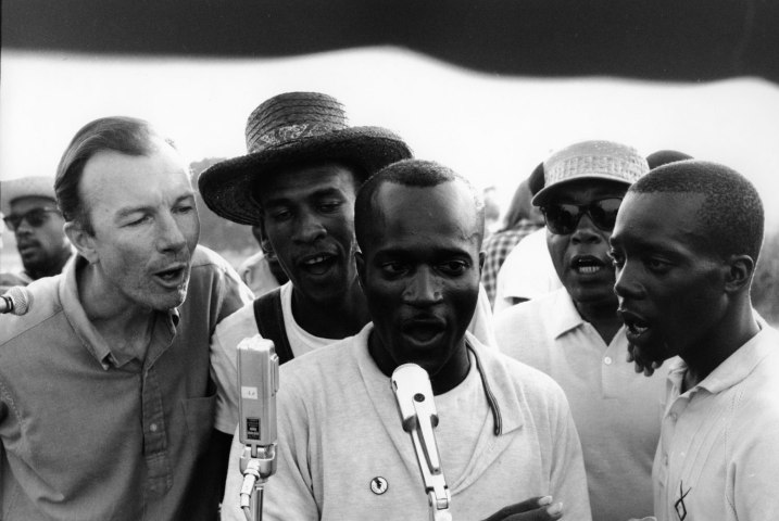 American folksinger and activist Pete Seeger sings with fellow activists at a Student Nonviolent Coordinating Committee (SNCC) rally, in Greenwood, Miss., in 1963.
