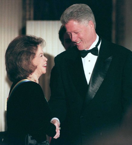 From left: Shirley Temple Black greets by U.S. President Bill Clinton during a reception at the White House in Washington, D.C., on Dec. 6, 1998.